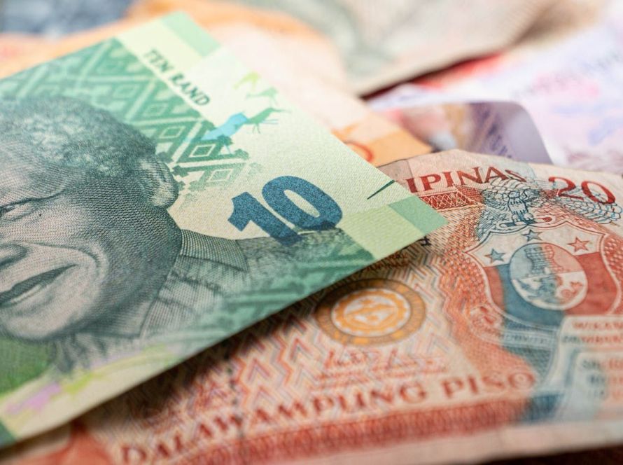 A detailed image featuring South African rand and Philippine pesos, highlighting cultural diversity in currency.